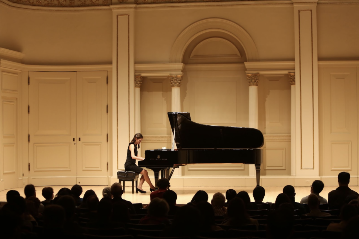 Junior Francesca Cho performing at the Weill Recital Hall at Carnegie Hall in New York City at a competition by the American Fine Arts Festival (AFAF). She showcased her musical talent on a stage that many Conservatory-trained musicians aspire to be at. (Courtesy of Francesca Cho) 